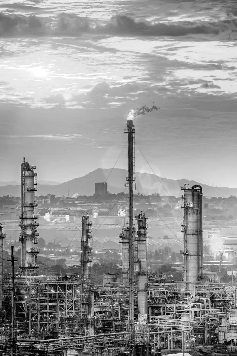 Process plant columns and pipe racks with hills in the background